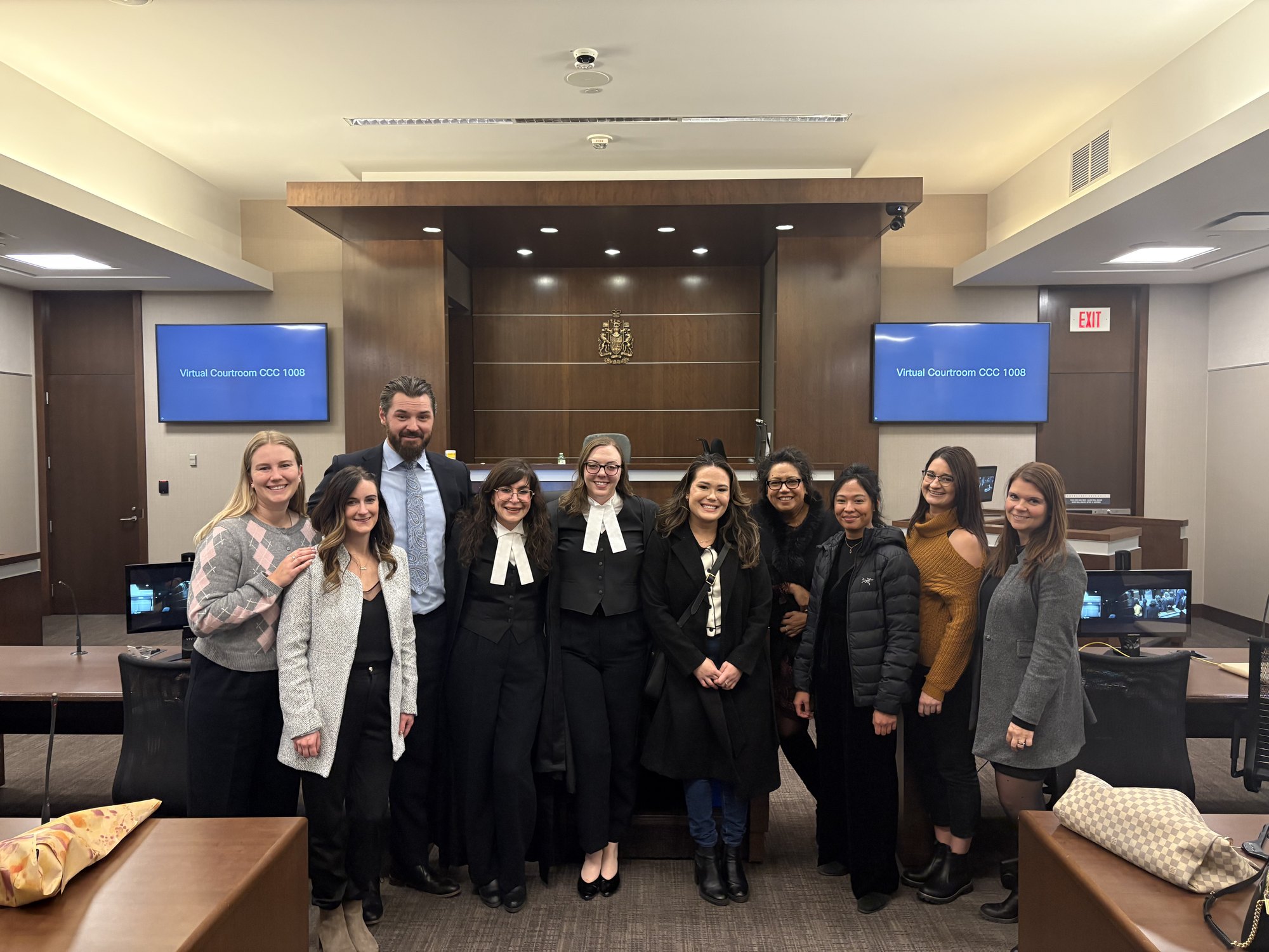 The Snukal Law Office team together in a Calgary courtroom
